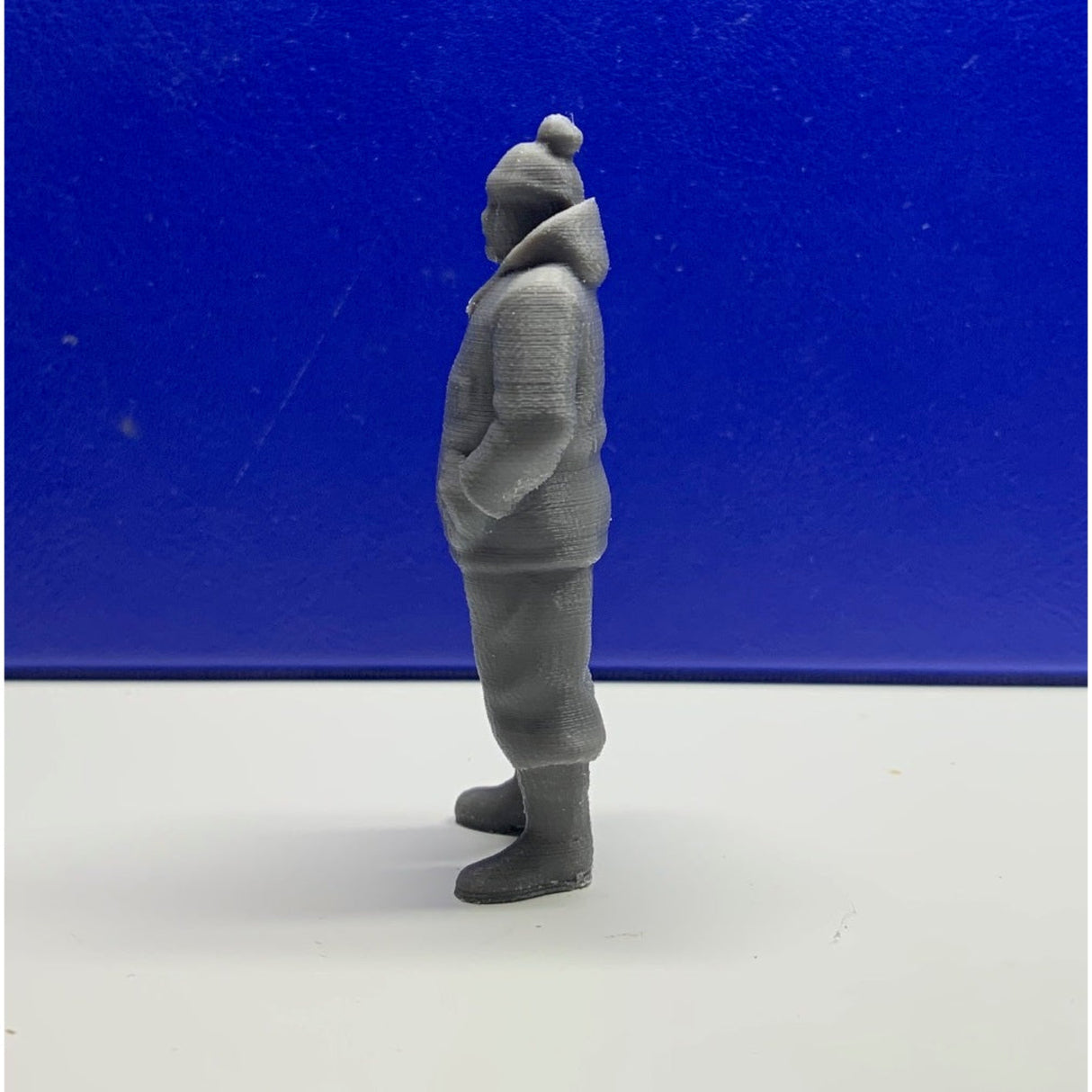 Side profile of 3D printed fishermen wearing bobble hat and waterproof boots for model boats Deckhand Crew Figure