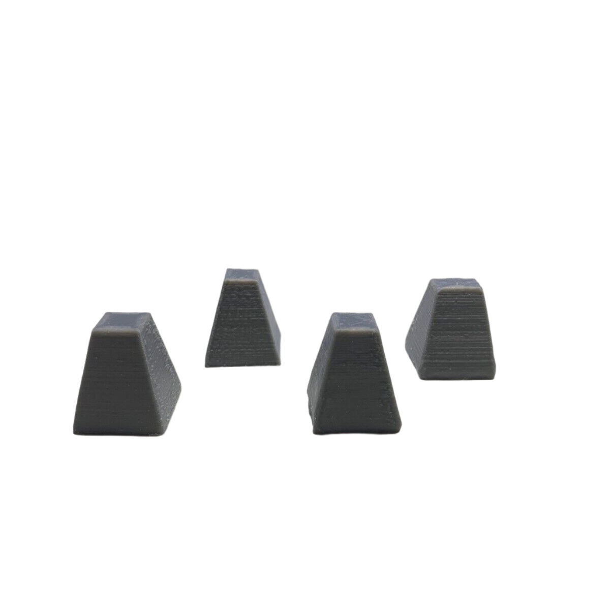 Four 3D printed Dragon’s Teeth anti-tank barriers arranged in staggered formation for wargames and diorama displays
