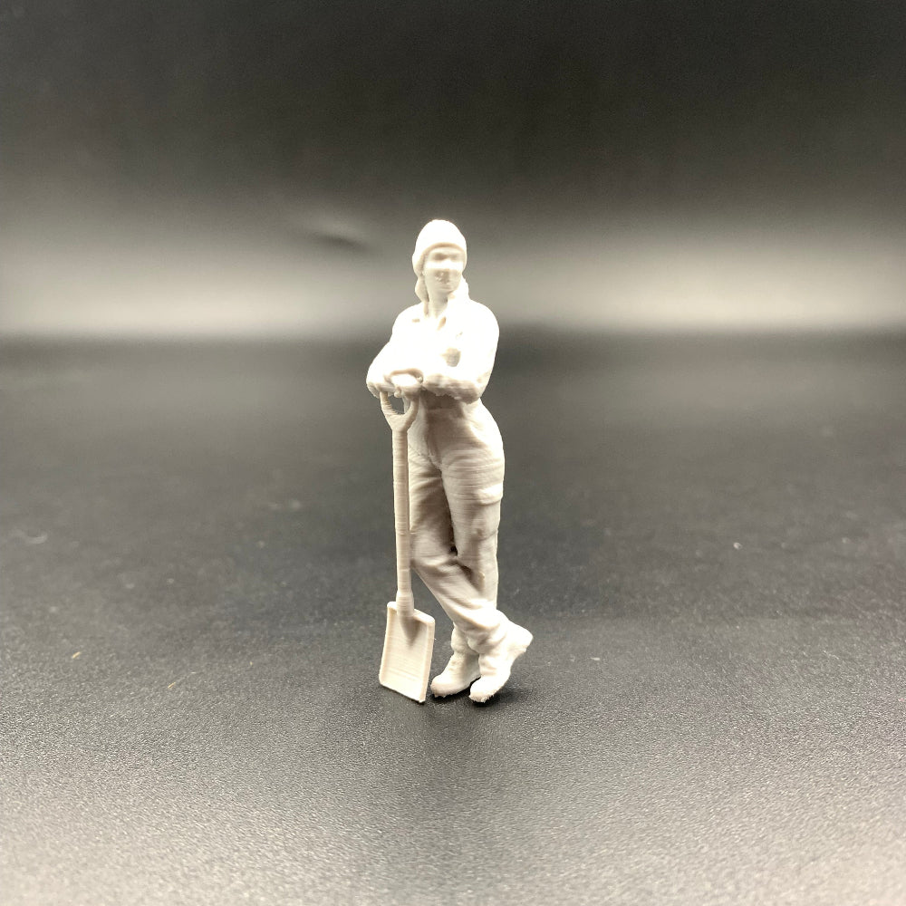 Female Mechanic Engineer Crew Figure Leaning on Shovel