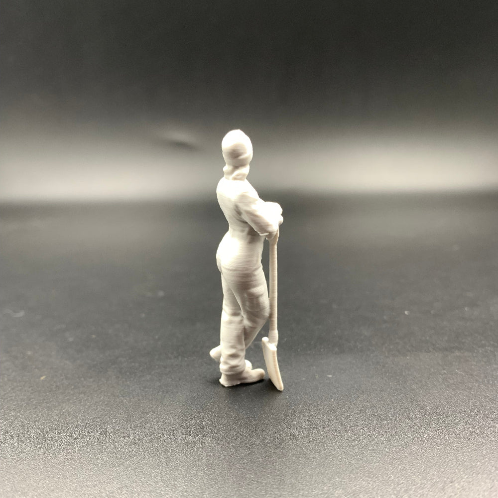 Female Mechanic Figure Leaning on Shovel