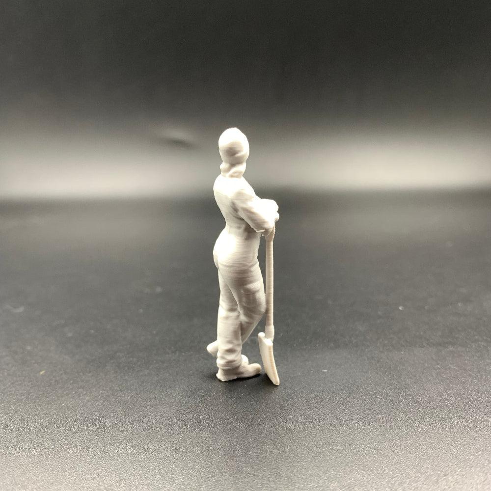 Female Mechanic Figure Leaning on Shovel