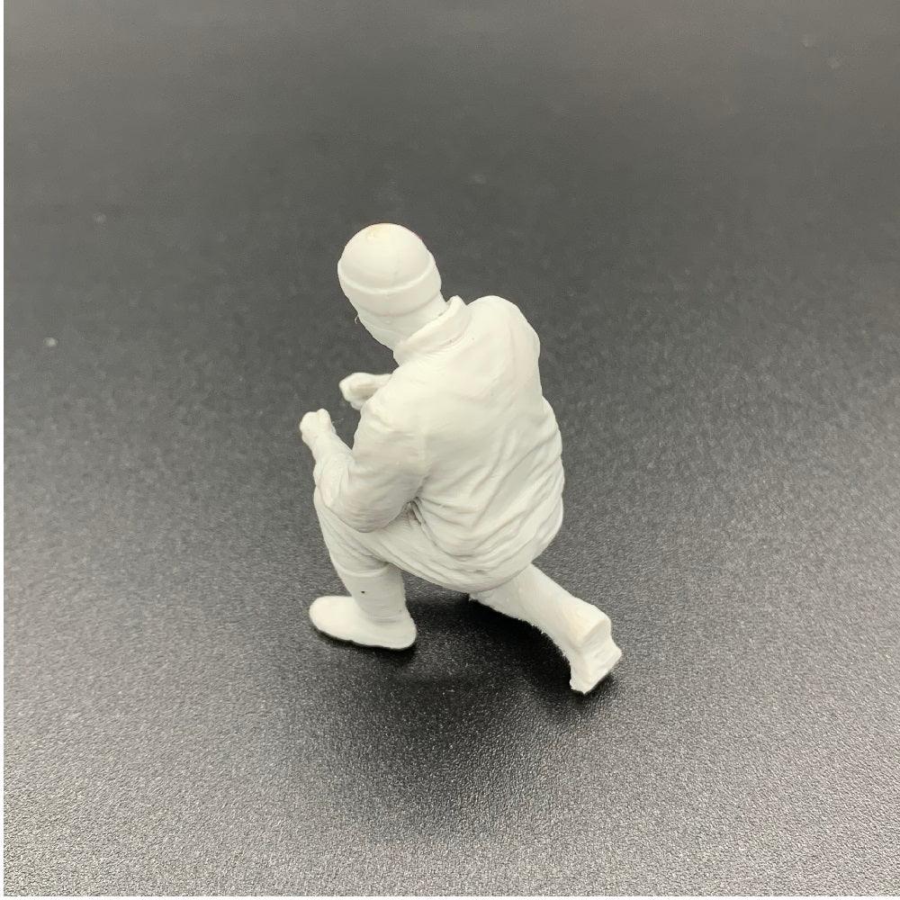 Kneeling deckhand crew figure for model fishing vessels