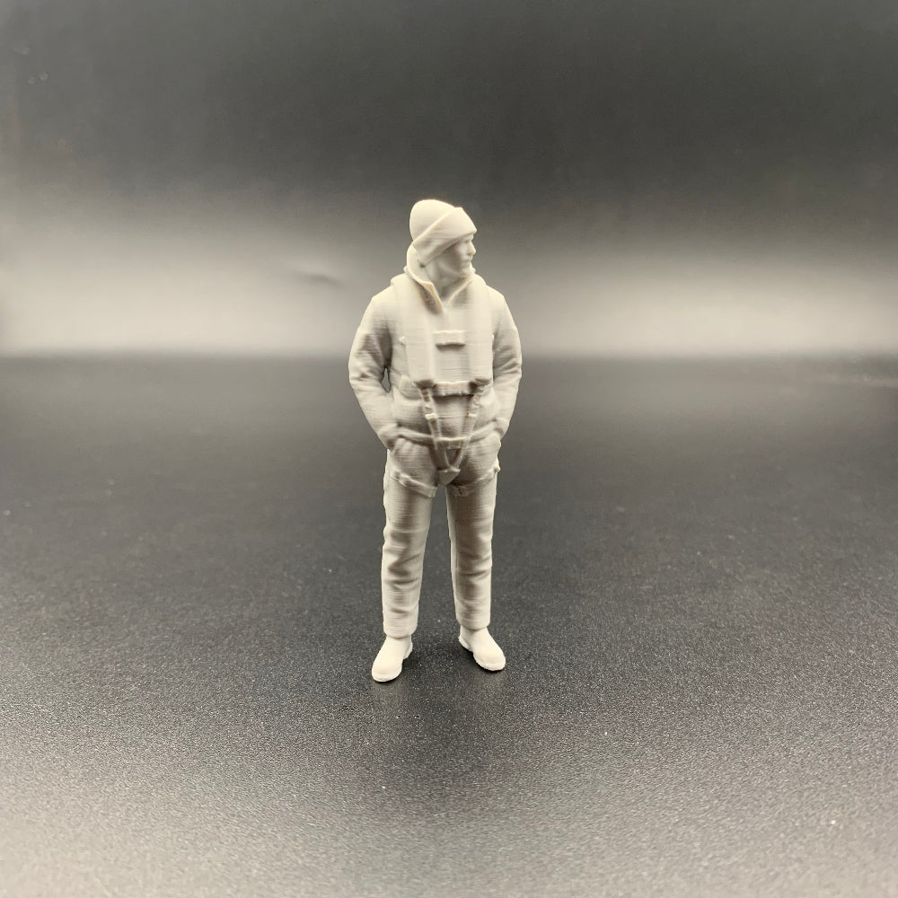 Lifeboat rescue crew figure wearing maritime gear and knitted hat shown from front view
