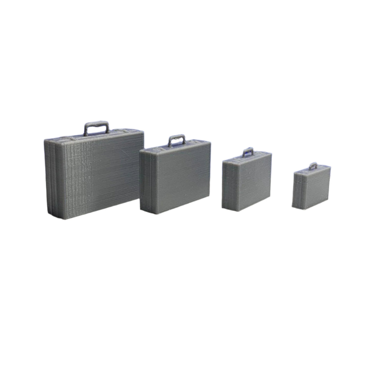 Four grey unpainted 3D printed miniature classic briefcases arranged diagonally by size for scale models
