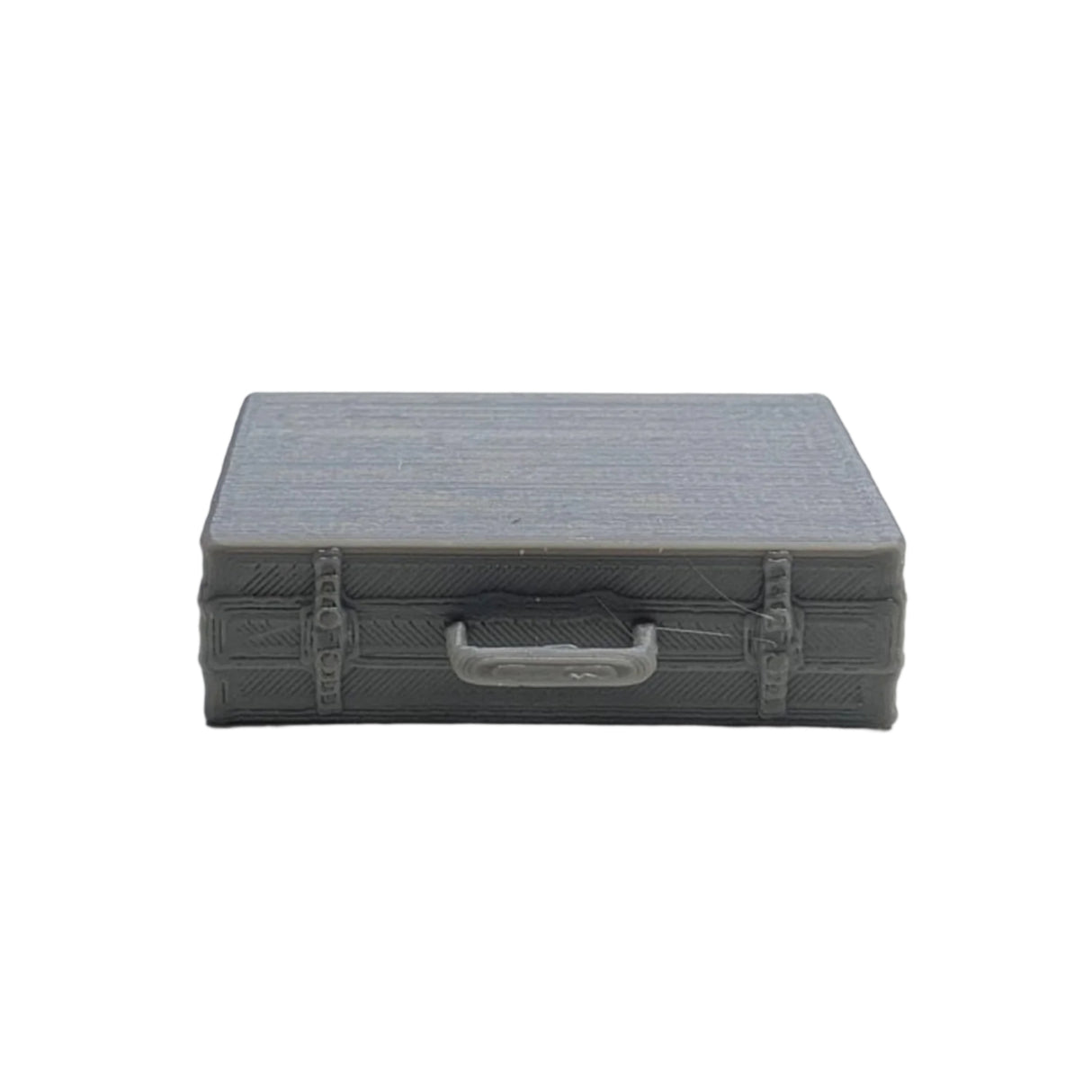 Top-down view of grey 3D printed miniature classic briefcases laying flat for model scenes
