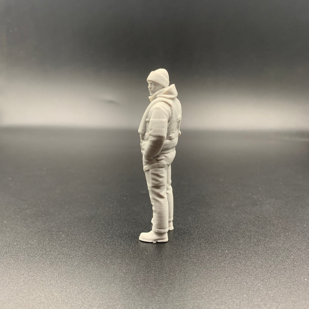 rescue crew figure shown from side view wearing weather gear and beanie hat