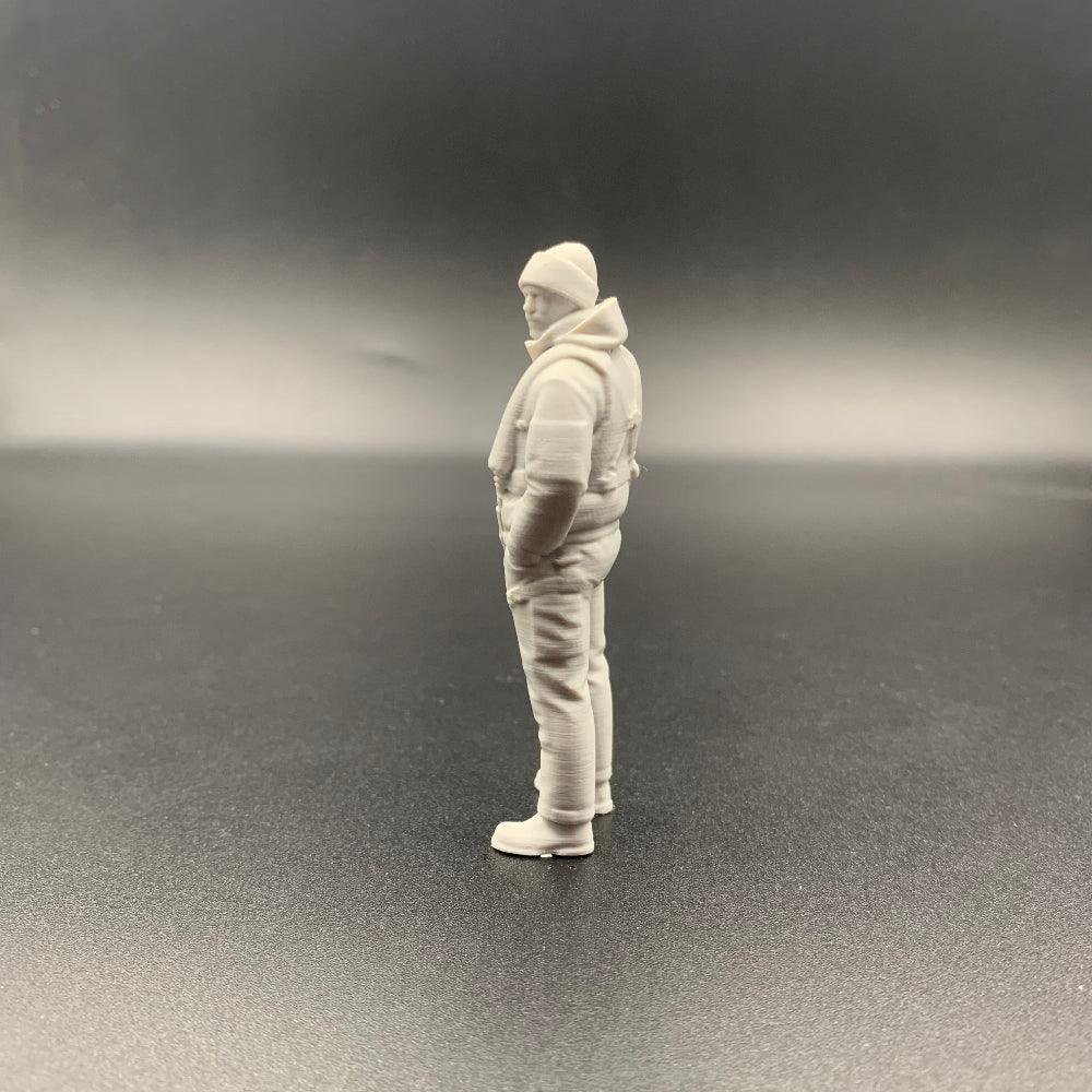 rescue crew figure shown from side view wearing weather gear and beanie hat