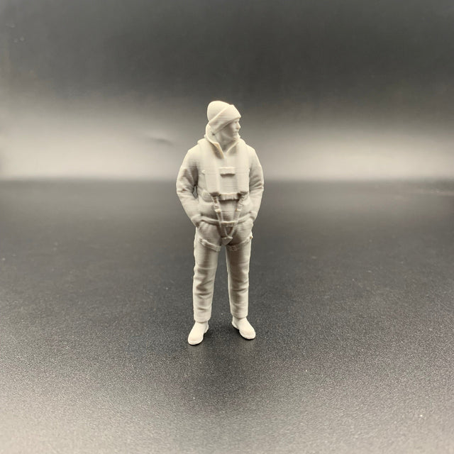 Lifeboat rescue crew figure wearing maritime gear and knitted hat shown from front view