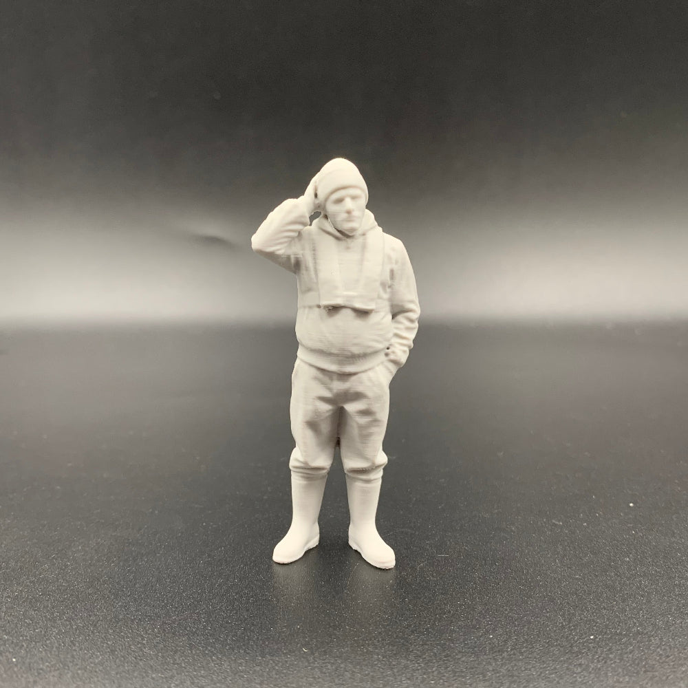 Fisherman model boat crew figure with slim lifejacket and hand resting on head in thoughtful pose