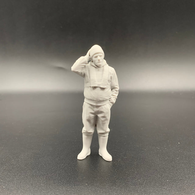 Fisherman model boat crew figure with slim lifejacket and hand resting on head in thoughtful pose