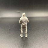 Unpainted 3D printed crew figure carrying a cup of tea or coffee for maritime and railway layouts