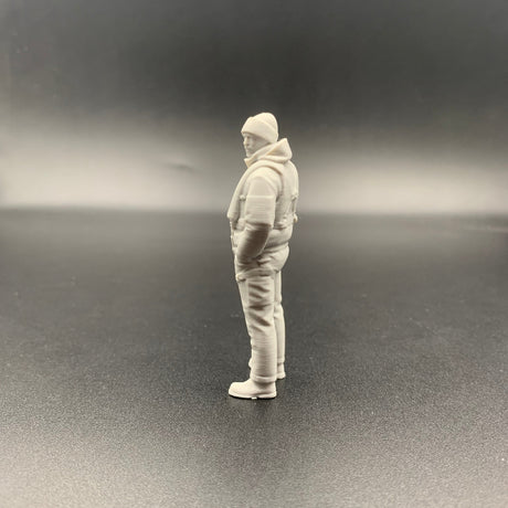 rescue crew figure shown from side view wearing weather gear and beanie hat